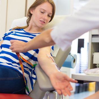 Role of nurses in blood services and donor sessions.  Nurse and blood donor at donation.