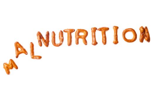 Tumbled word MALNUTRITION written, laid-out, with crispy alphabet pretzels isolated on white background