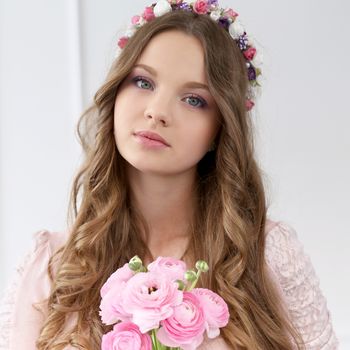 Cute, young girl with flowers