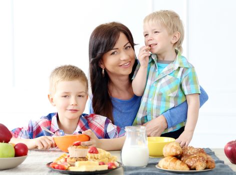 Mother and two brothers during family breakfast