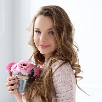 Cute, young girl with flowers