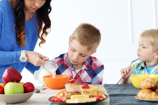 Mother and two brothers during family breakfast