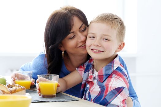 Mother with kid during family breakfast