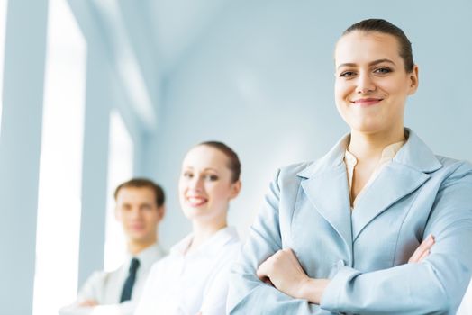 successful businessmen, a portrait of a business woman standing next to colleagues