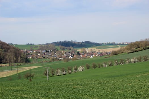 Open country side of Baden-Wurtembergy with small village in the distance.