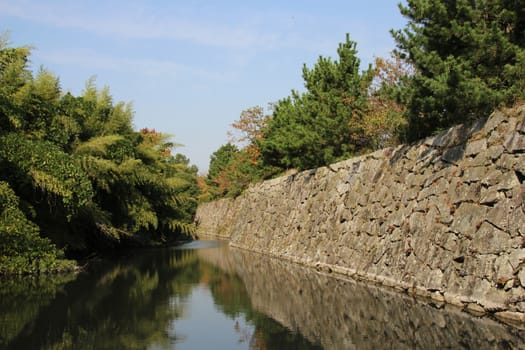 The remaining outer wall and moat around Kyoyama Castle, Nara, Japan.