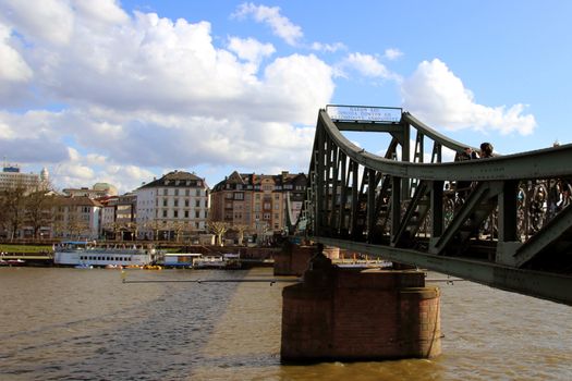 Eiserner Steg is a pedestrian bridge in Franfurt Germany that crosses the Main River and is covered with love padlocks.