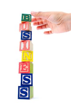 Building letter blocks stacked together to create business 