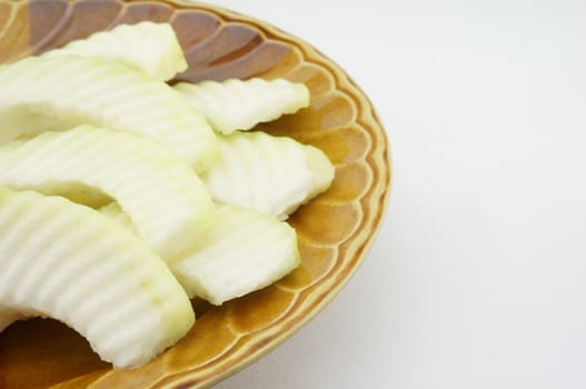 Sliced guava on the plate Brown with white background for diet.