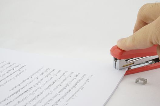 Stapler allows paper documents are organized and beautiful. Documents are scattered