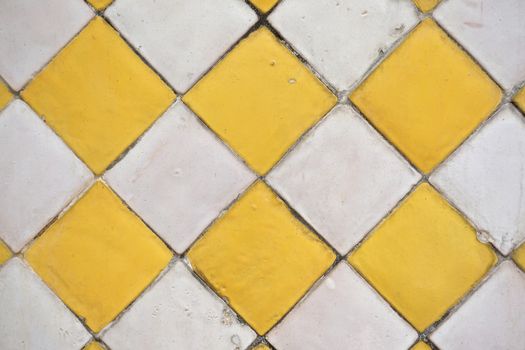 Old ceramic tile have colour yellow and white decor at temple Thailand.