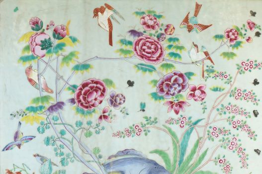 Bird, butterfly and dragonfly are flying around red and purple peony