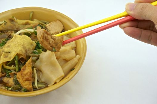 Eating soup white rice noodle with fried tofu, bean sprouts, morning glory vegetarian for health.