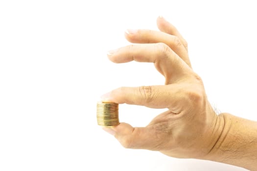 Hand holding pile of gold coin, look like hand signals OK.