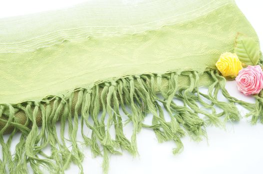 Large green scarf for the neck when cold folding placed on a white background.