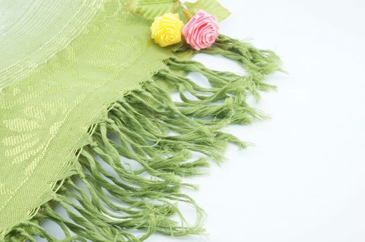 Large green scarf for the neck when cold folding placed on a white background.