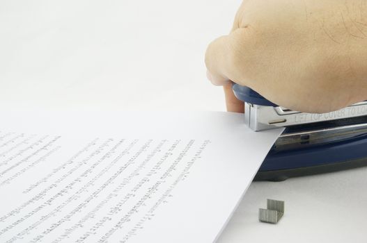 Stapler allows paper documents are organized and beautiful. Documents are scattered