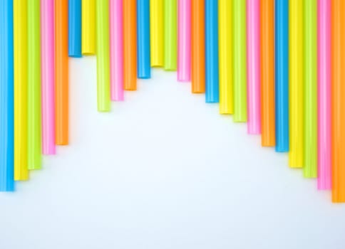 Colorful straight straw put continual as the beautiful background color look like house.