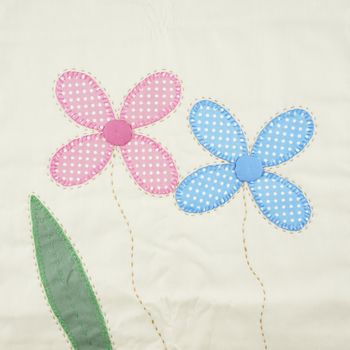 Textile texture pink and blue floral with green leaf pattern from pillowcase