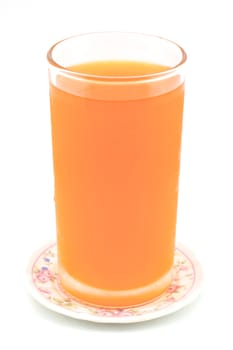 Cold orange juice in glass placed on coasters with white background.