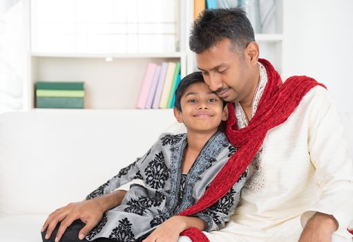 Portrait of Asian Indian father and son at home.