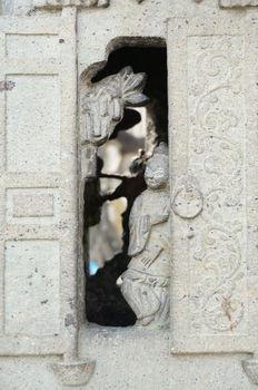 Smile girl stand at door of old stone kiln Wat Pho Thailand. 