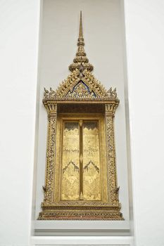 Golden window of the Temple, which is located on Wat Suthat Thep Wararam