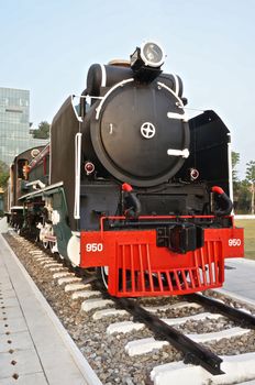 Black and red locomotive is on display in the park at Siriraj Hospital Bangkok Thailand.