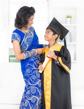 Kindergarten graduation. Asian family, Indian mother and son on kinder graduate day.