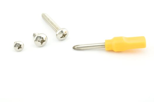 Yellow screwdriver with screw use for minor repair with white background.