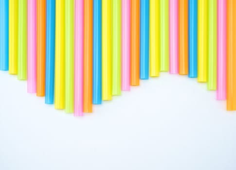 Colorful straight straw put continual as the beautiful background color look like wave.