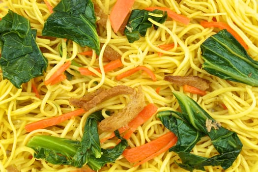 Long life noodle fried with kale, carrots and vegan protein dry.