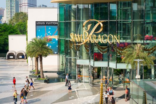BANGKOK - DEC 20: Entrance in Siam Paragon shopping mall. It is popular luxury fashion shopping mall in Bangkok