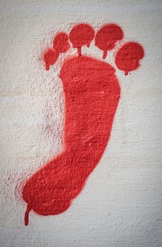 Detail Of A Red Graffiti Foot On A Wall