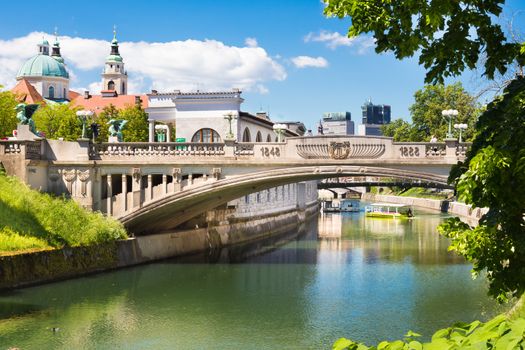 Cityscape of the Slovenian capital Ljubljana. Dragon bridge over Ljubljanica river.