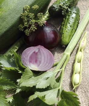 Close up fresh red onions with other vegetables 