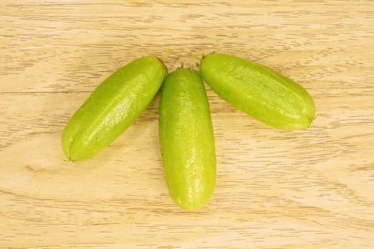 Averrhoa bilimbi or cucumber is green bio fruit place on wood background