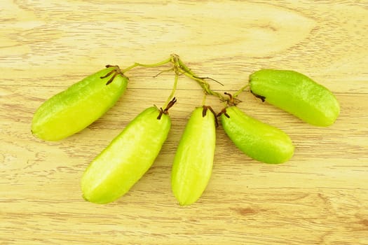 Averrhoa bilimbi or cucumber is green bio fruit place on wood background