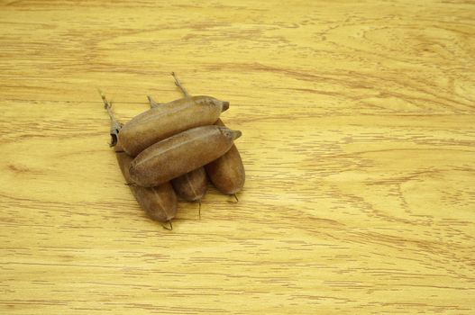 Seed of Thunbergia laurifolia  like pod put on wood background.