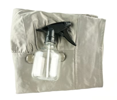 Black water sprayer put on skirt isolated with white background.