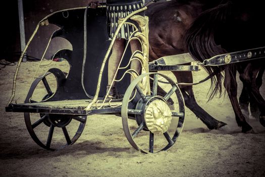 Roman chariot in a fight of gladiators, bloody circus