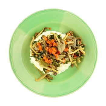 Carrot fried with oyster mushroom, vegan protein and basil on rice isolated white background.