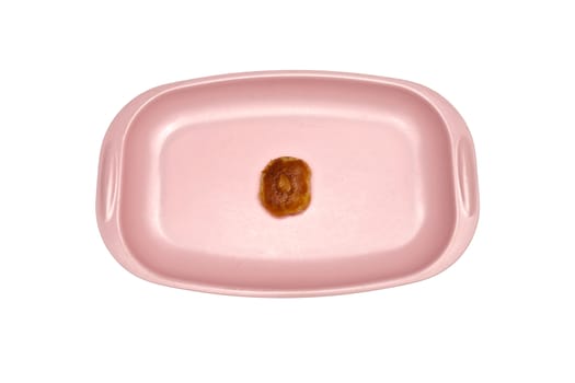 Cookie and cashew nut put on pink tray isolated with white background.