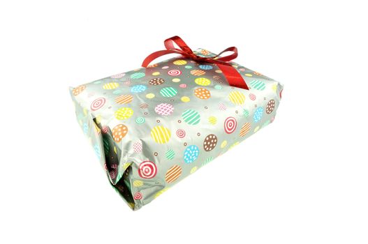 Gift wrap with paper colorful circle pattern and red ribbon isolated on white background.