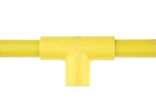 Yellow plastic pipe with joint three way isolated on white background.
