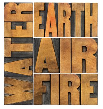water, earth, air and fire - four philosophical elements concept - isolated word abstract in letterpress wood type