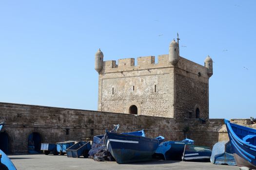 Blue fishing boats and fortress at Essaouira in Morocco
