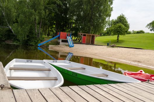 summer relaxation sandy beach shore and moored boats