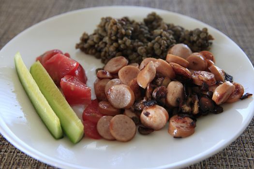 cut sausage with fresh cucumbers and tomato