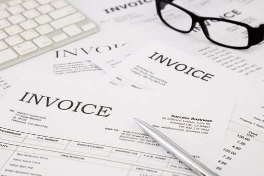 difference invoices and bills, paperwork on office table